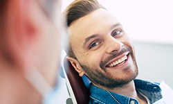 Man smiling at dentist in treatment chair