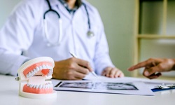 dentist discussing X-rays with patient