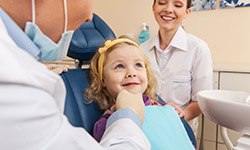 Smiling little girl in dental chair