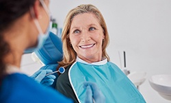 a patient smiling during her dental appointment