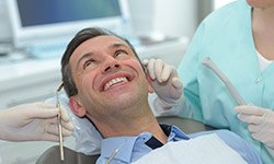 Smiling older man in dental chair