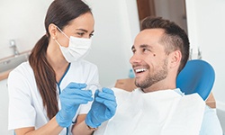 dentist talking to a patient about the cost of Invisalign in Middleburg Heights 