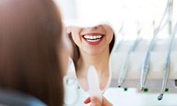 Patient looking at smile in mirror