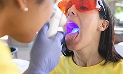 Woman receiving oral cancer screening