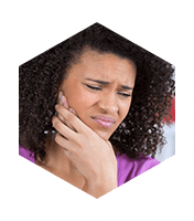 Woman in pain holding cheek