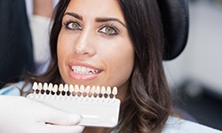 woman smiling with porcelain veneers in Middleburg Heights 