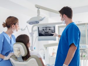 dentist in Middleburg Heights showing a patient their dental x-rays 